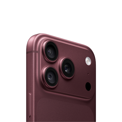 Close-up of the rear upper section of a smartphone in a metallic rose-pink finish, showing a triple-camera system and flash on a clean white background.
