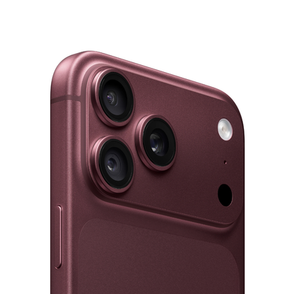 Close-up of the rear upper section of a smartphone showing a metallic deep plum-purple finish, three rear cameras, and a flash on a clean white background.